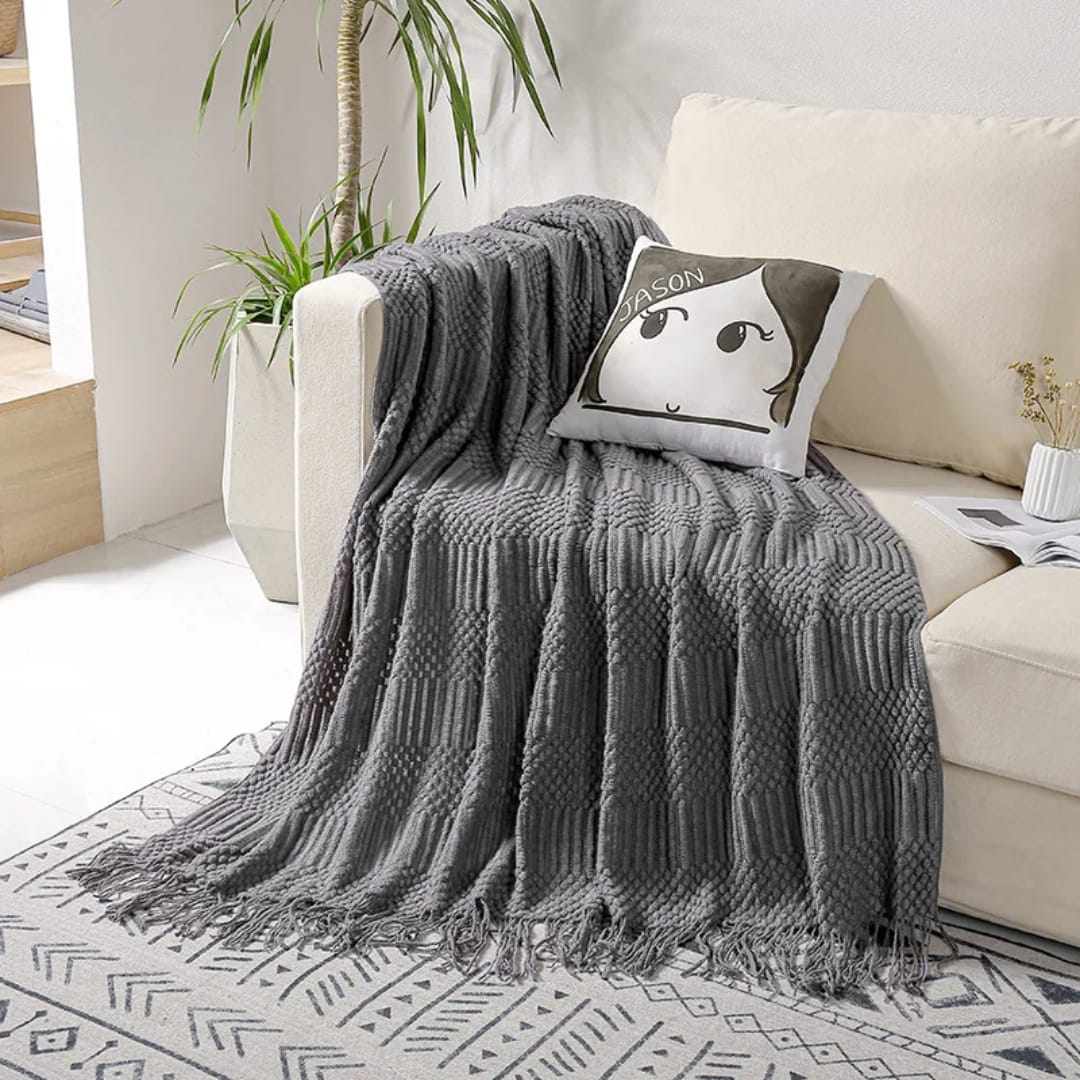Soft throw blanket sized 130 × 220 cm draped on a sofa for home décor and warmth