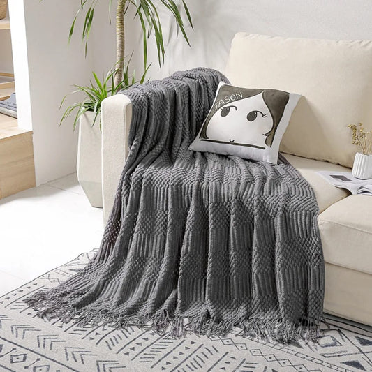 Soft throw blanket sized 130 × 220 cm draped on a sofa for home décor and warmth