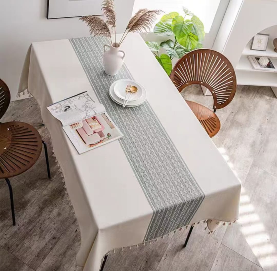 Dining table cloth measuring 140cm by 220cm.