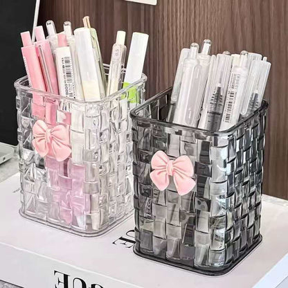 Clear acrylic organizer for makeup brushes, pens, and small office accessories.