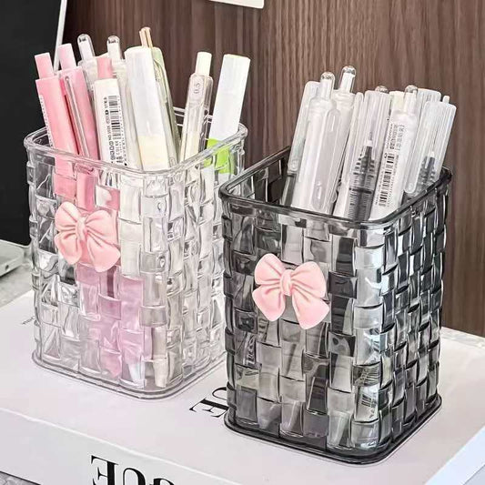 Clear acrylic organizer for makeup brushes, pens, and small office accessories.
