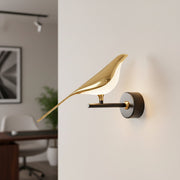 Dawood Lifestyle & Gadgets kes Gold Bird LED Wall Lamp with illuminated white bird, matte black arm, and luxury wall-mounted lighting fixture.