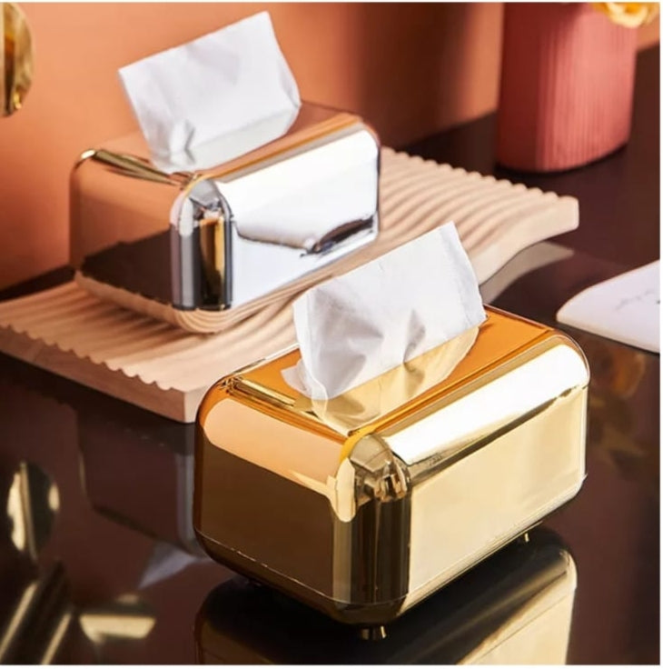 Silver metallic serviette holder for table use.