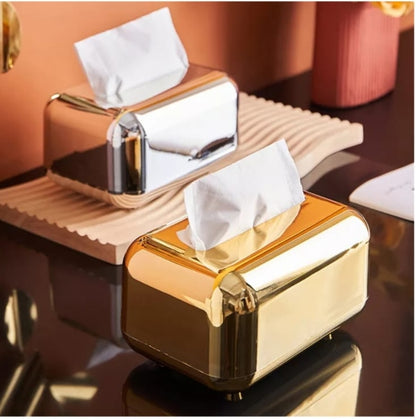 Silver metallic serviette holder for table use.