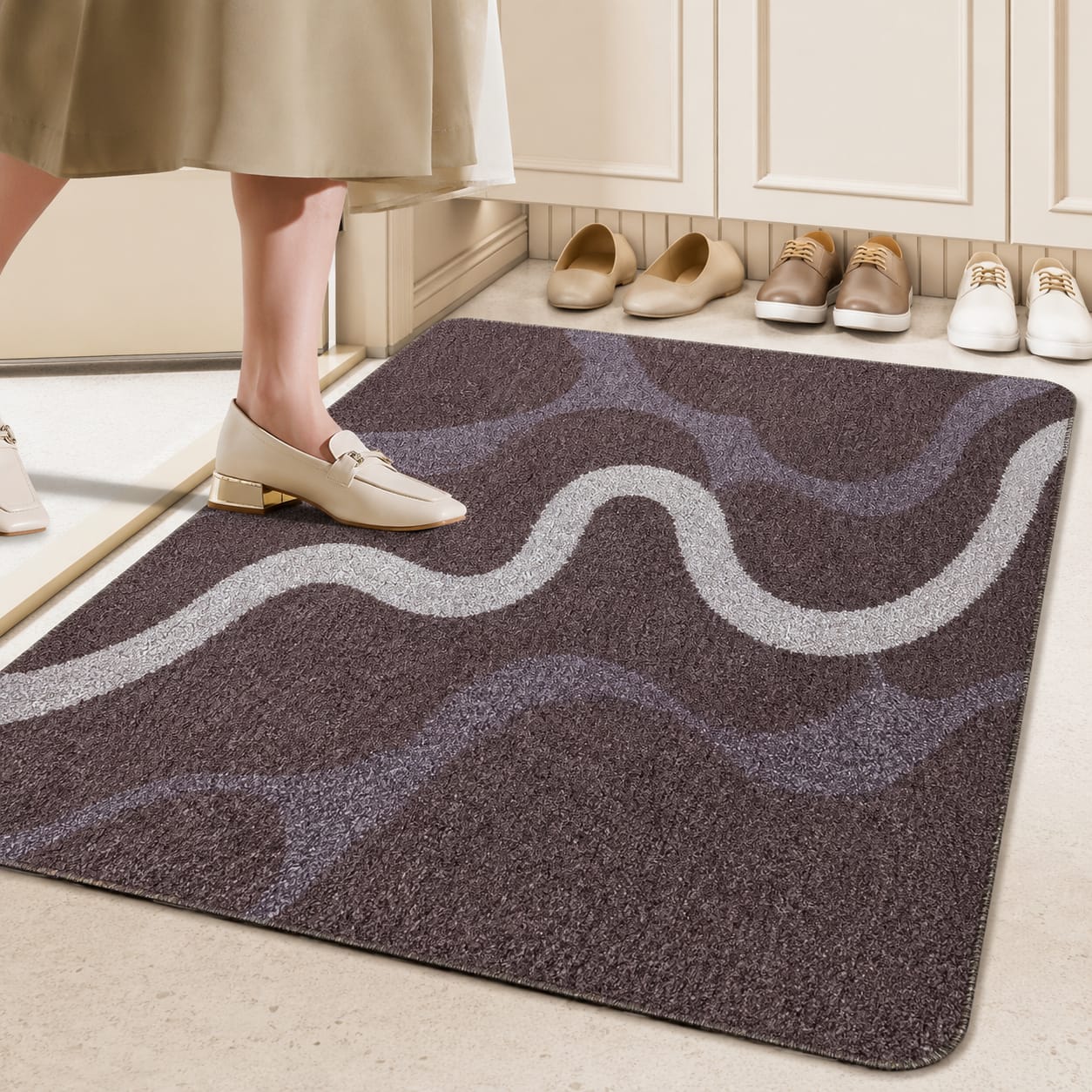 Elegant swirl design entry mat measuring 50 × 80 cm with a textured surface and non slip backing for stylish floor protection.