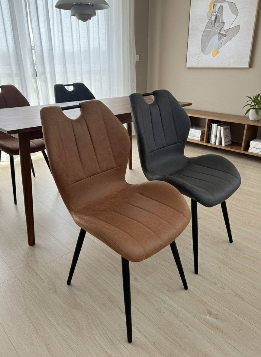 Leather dining chair with padded seat and modern design.