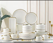 32-piece dinner set with gold-edged striped design, including plates, bowls, and serving pieces