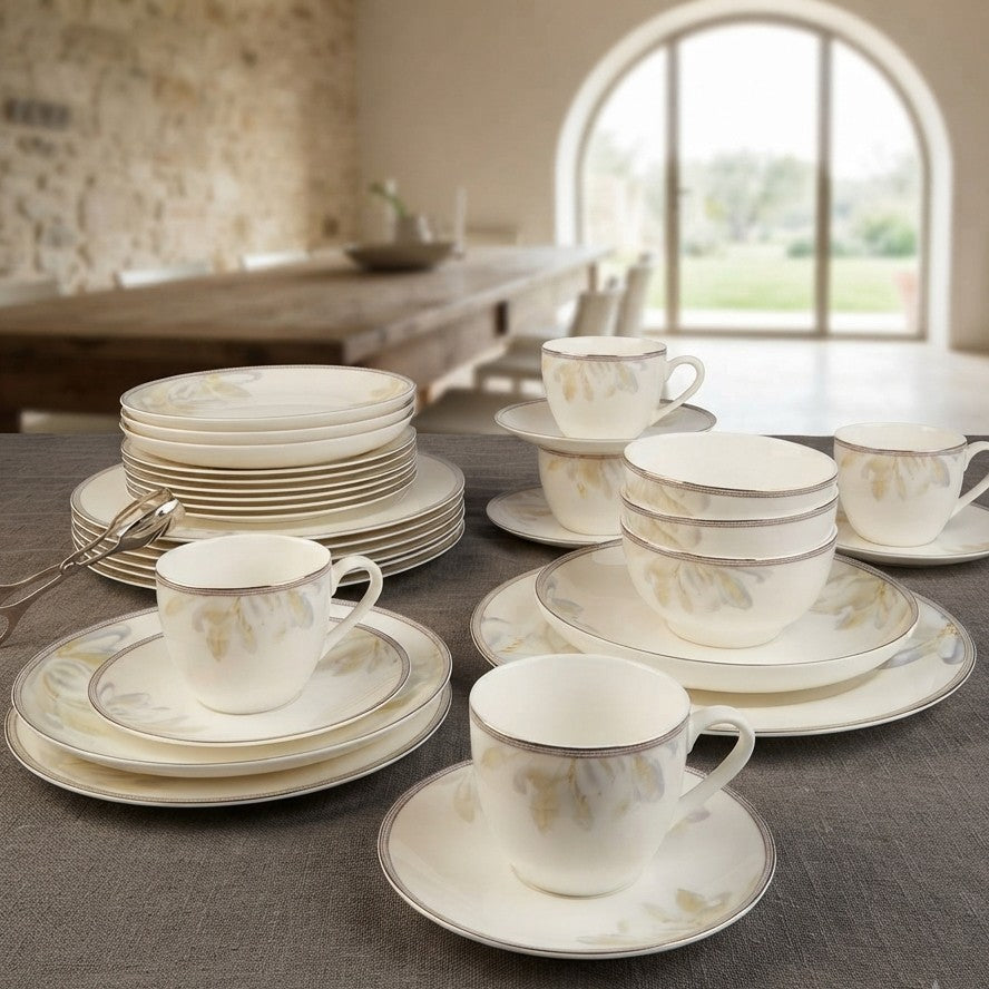 36 piece white floral ceramic dinner set with dinner plates, side plates, bowls, cups, saucers, and plate bowls.