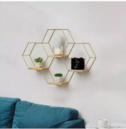 Dawood Lifestyle & Gadgets kes 4-piece gold hexagon floating wall shelf set with natural wood bases in a geometric honeycomb design for decorative home storage and display.