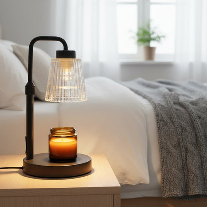 Metal electric candle warmer for flame-free candle melting and fragrance release.