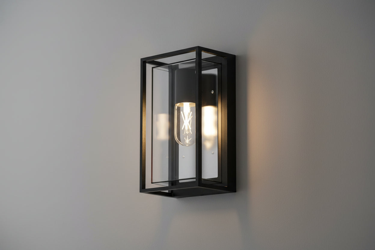 Black outdoor wall light with box frame design, clear glass panels, and E27 holder, IP65 weatherproof fixture