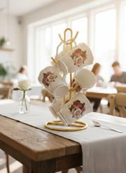 Set of six gold-rimmed bone china tea mugs with floral design