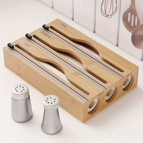3 in 1 bamboo kitchen paper dispenser with three layers and built in cutters for paper rolls foil and cling film available in black and brown for kitchen organisation
