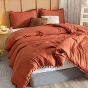Pom pom laced design microfibre duvet cover set with one duvet cover and two pillowcases in 6 × 7 ft and 6 × 6 ft sizes.