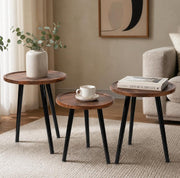 Set of 3 round nesting coffee tables with dark wood look tops and black metal legs for modern living room.