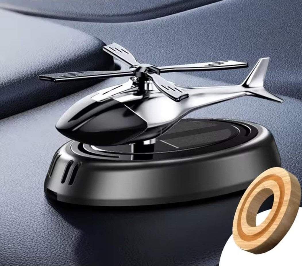 Solar-powered helicopter car air freshener with rotating fan, 360-degree fragrance dispersal, available in black, blue, and red. 