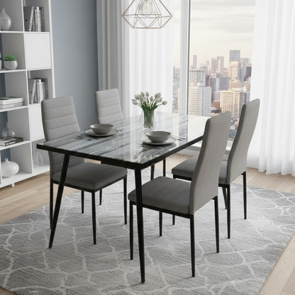 Modern 4-seater dining set with clear glass top and matching chairs.
