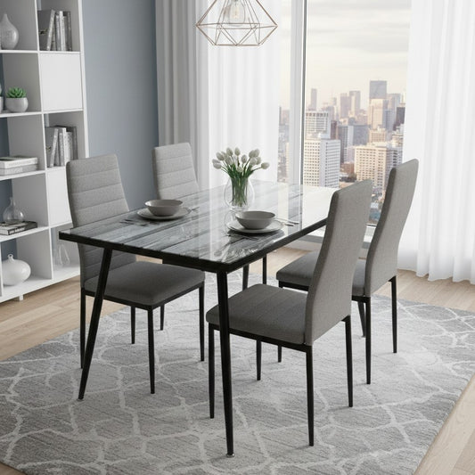 Modern 4-seater dining set with clear glass top and matching chairs.