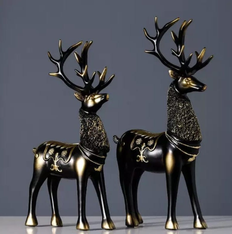 Set of two Nordic style luxury deer ornaments available in gold, black, and green.