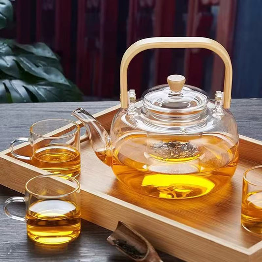Luxury glass tea set with 1400ml teapot, 6 glass cups, and bamboo serving tray. 🍵✨