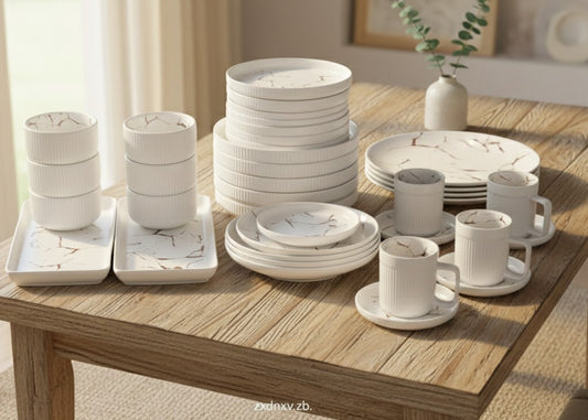 32-piece matte stoneware marble finish dinner set in black or white with plates, bowls, mugs, saucers, and platters