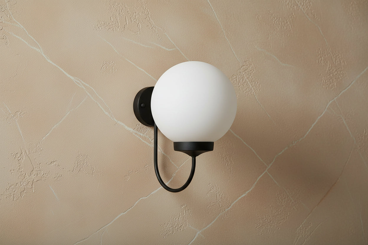 Black plug-in wall light with opal globe shade, modern E27 decorative lighting fixture with soft diffusion