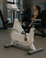 Spin exercise bike with 10kg flywheel, Bluetooth app compatibility, heart rate monitor, and accessories.
