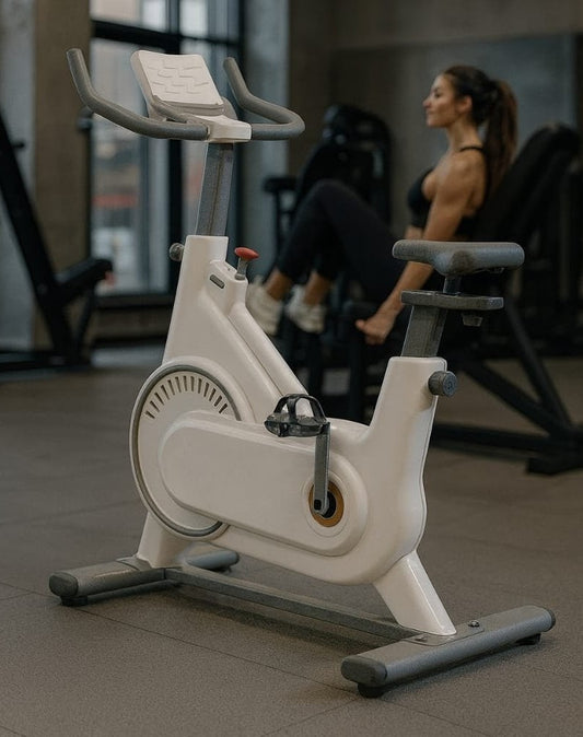 Spin exercise bike with 10kg flywheel, Bluetooth app compatibility, heart rate monitor, and accessories.
