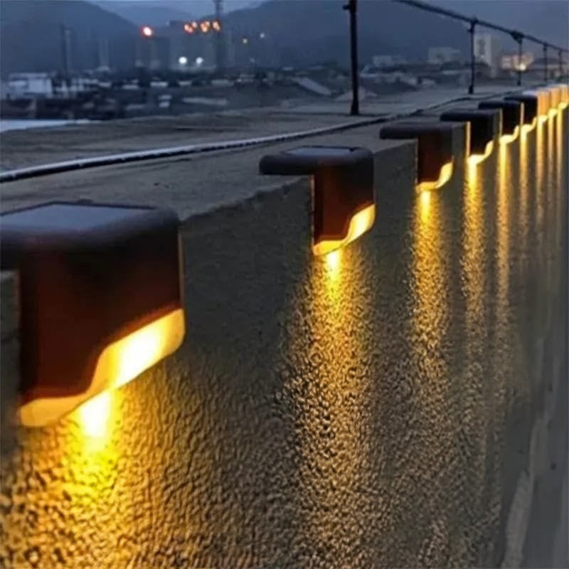 Set of 8 solar garden lights designed for outdoor pathways and landscape lighting using solar energy.