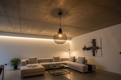 Matte black industrial cage pendant light with metal mesh dome for modern ceiling lighting effect