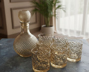 Gold crystal 7-piece glass decanter set.