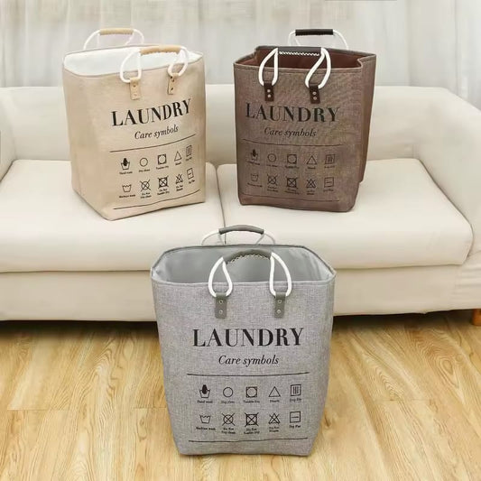 Large collapsible laundry hamper with leather handles, washable fabric
