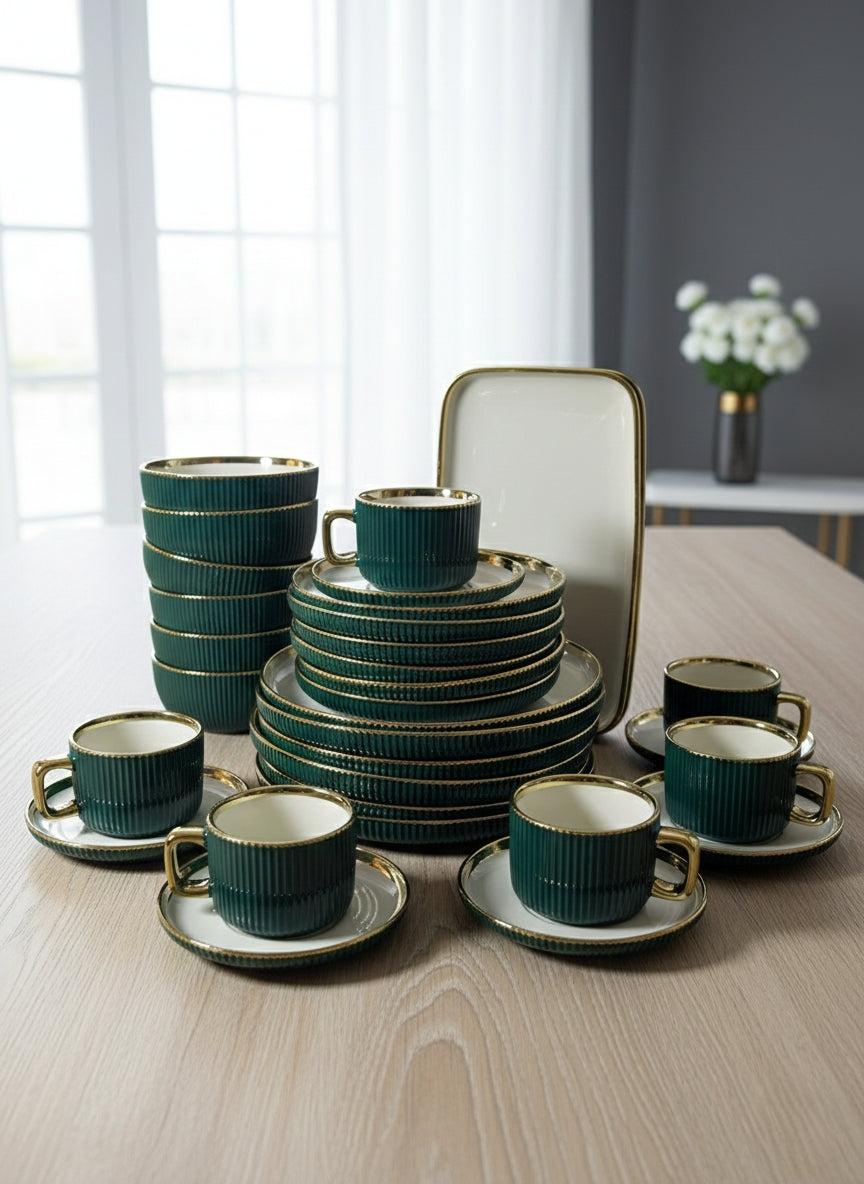 Gold accented thirty two piece dinner set with plates, bowls, cups, and platters