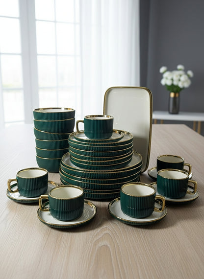 Gold accented thirty two piece dinner set with plates, bowls, cups, and platters