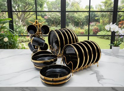 24-Piece Black and gold ceramic dinner set with plates, bowls, and cups.