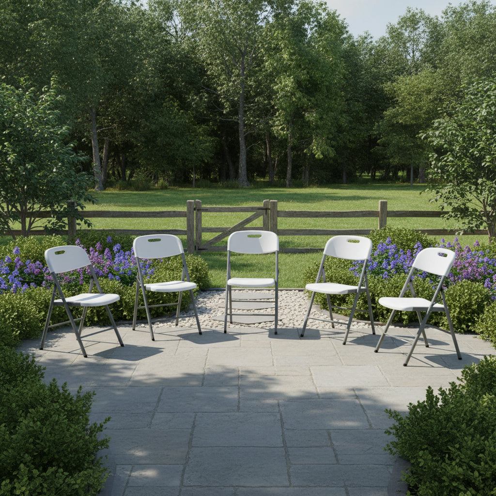 White plastic folding chair with gray powder-coated metal frame and carry handle cut-out on the backrest.