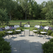 White plastic folding chair with gray powder-coated metal frame and carry handle cut-out on the backrest.