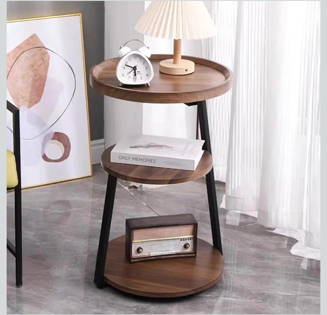 Round metal frame side table with black finish for living room or bedroom use