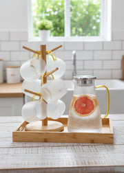 Transparent snowflake glass jug set with stand, tray, and six cups.