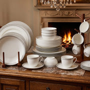 36pcs ceramic dinner set with white flowered design including plates, bowls, cups, and saucers. 🍽️🌸✨