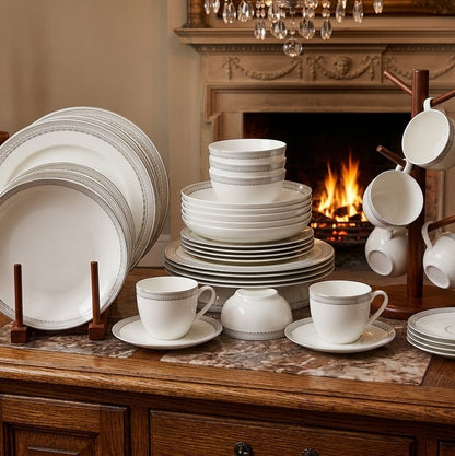 36pcs ceramic dinner set with white flowered design including plates, bowls, cups, and saucers. 🍽️🌸✨