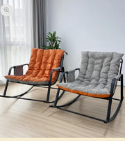 Modern rocking chair with orange tufted cushion, comfortable indoor and outdoor seating for relaxation.