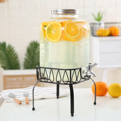 Glass beverage dispenser with metal stand and tap, available in 5L and 8L, ideal for serving drinks at home or events. 