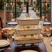 Three piece ceramic chafing dish set for serving and keeping food warm.