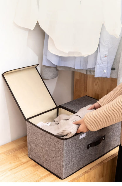 Grey foldable cotton linen storage box with double cover and partitioned compartments.
