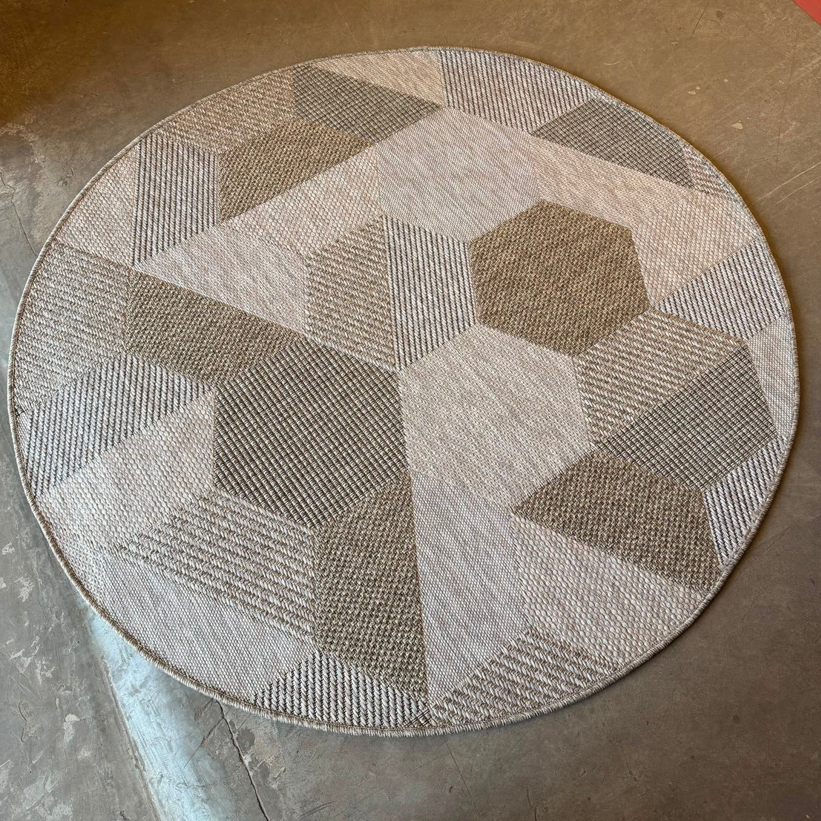 Oriental Weavers Oria round geometric flat weave rug with 3D beige, taupe and stone patchwork design.