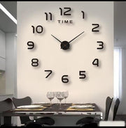 DIY acrylic wall clock with modern sticker design.