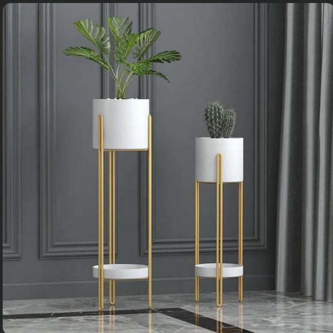  Text
White decorative planter stand for indoor and outdoor plants.