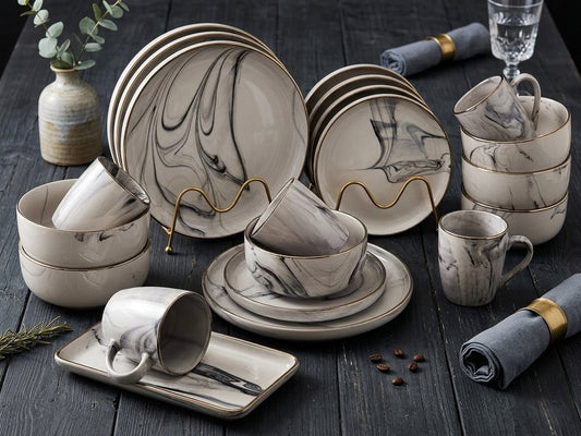 26-piece marble dinnerware set including plates, side plates, bowls, cups, and platters for elegant dining. 