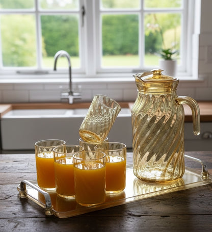 Glass jug set with glasses and tray, available in gold and black.